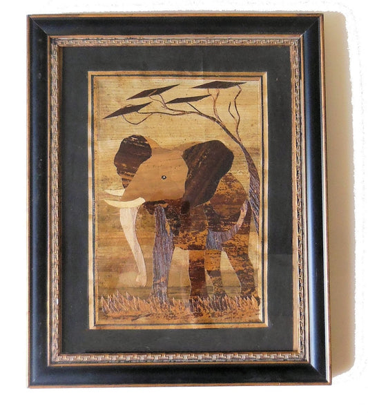 Tanzania- Intricately cut wood elephant on Fabric.  Framed.
